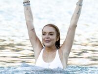 Lindsay Lohan Shows Her Big Tits On A Beach