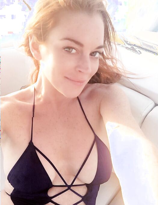 Lindsay Lohan Shows Her Big Tits On A Beach