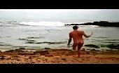 Booty buffer Liam Browne runs naked across the beach